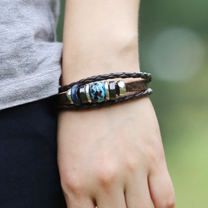 Multi-layer vintage braided leather bracelet with blue beaded metal accent on wrist