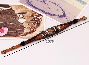 Detail of multi-layer leather bracelet with bronze sun totem and 22cm adjustable snap button
