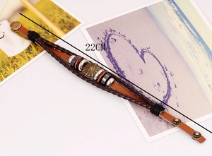 Macro view of multi-layer leather bracelet with star metal plate and 22cm snap button