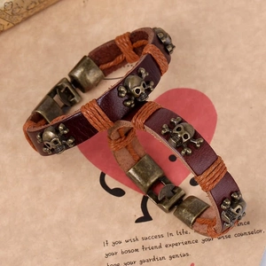 Retro punk style braided leather bracelet set with bronze skull and crossbone charms