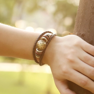 Retro multi-layer woven leather bracelet featuring a vintage bronze star charm for men