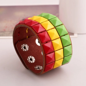 Wide punk leather bracelet with red, yellow, and green studs and adjustable snap buttons