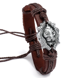 Handmade woven vintage brown leather lion head bracelet for men on white background