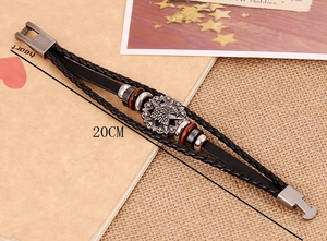 Detail view of 20cm punk leather bracelet with metal eagle charm and wooden beads