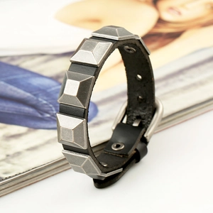 Vintage black leather punk bracelet with silver pyramid studs and adjustable buckle clasp