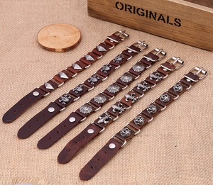Five-piece set of vintage brown genuine leather bracelets with metallic skull and star charms