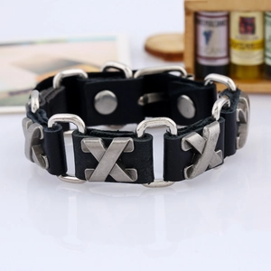 Punk style adjustable black leather bracelet with silver X-shaped metal studs and snap closure