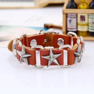 Punk style brown leather bracelet with vintage silver star studs for men on white table
