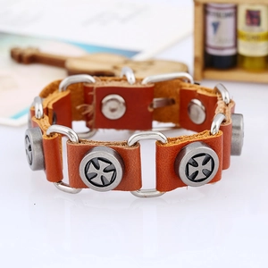 Close-up of punk leather bracelet with iron cross studs and metal connectors