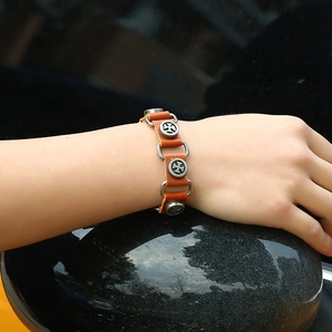 Punk style brown leather bracelet with silver metal cross rings and stud details