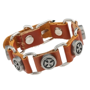 Punk style dark brown leather bracelet with silver Maltese cross metal charms on white background