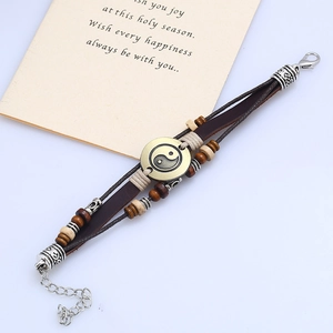 Vintage layered leather bracelet with Tai Chi Yin Yang symbol and beaded wood accents