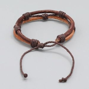 Handmade woven vegetable tanned leather bracelet in vintage brown with adjustable cord