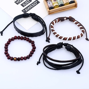 Set of 4 vintage braided leather bracelets with red wood beads and woven cords