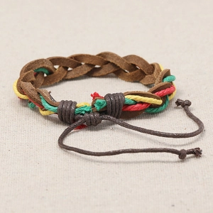 Retro multi-layer woven leather bracelet with colorful cords on beige linen background