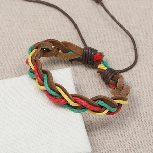 Multilayer braided cowhide leather bracelet with colorful cords on natural linen background