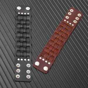 Detail of punk multi-layer leather bracelets with silver rivets and snap button closure