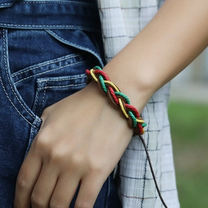 Multicolor woven leather bracelet in reggae style featuring red yellow and green cords