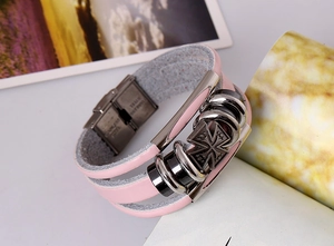 Detail of pink multi-layer leather bracelet with cross emblem and stainless steel clasp