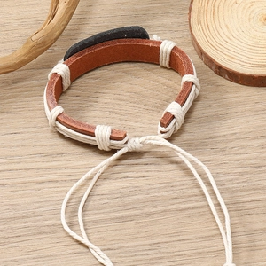Handmade woven leather bracelet with butterfly pattern and adjustable pull cord closure