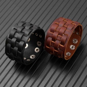 Detail of woven multi-layer leather bracelet with adjustable metal snap buttons