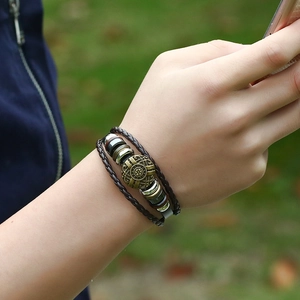 Braided leather bracelet with vintage bronze charms and beads for men, multi-layer design