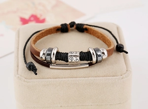 Detail of multi-layer leather bracelet with silver beads and adjustable knot closure