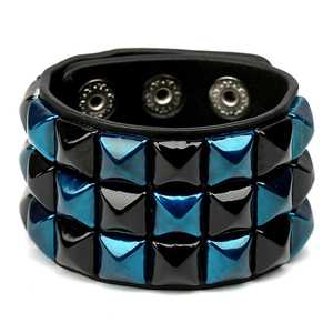 Punk leather bracelet with three rows of blue and black pyramid studs and snap buttons