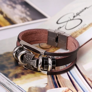 Multi-layer brown leather wrap bracelet featuring a cross pendant and stainless steel clasp