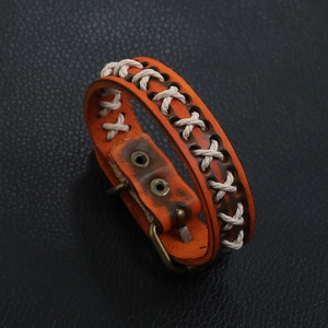 Vintage orange braided leather bracelet with retro metal rivets and strap buckle