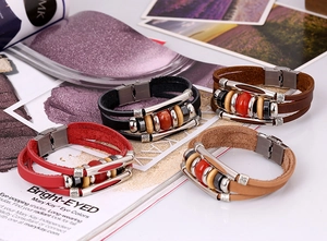 Detail of multi-layer leather bracelets with wooden beads and stainless steel clasp