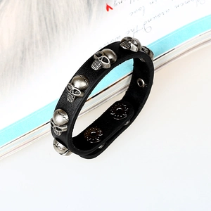 Retro punk black leather bracelet with five silver skull charms and snap buttons