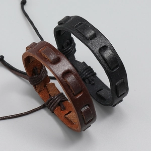 Detail of multi-layer hand-woven leather bracelets with adjustable braided rope knots