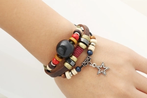 Bohemian multilayer genuine leather bracelet with wooden beads and star charm on wrist