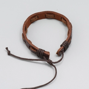 Close-up of hand-woven dark brown leather bracelet with adjustable coffee wax cord