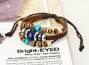 Detail of bohemian multilayer leather bracelet with wooden beads and turquoise accents