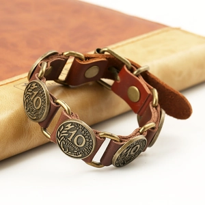 Retro brown leather bracelet with 1990 French coin charms in a vintage punk style