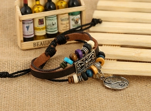 Detail of multi-layer leather bracelet with colorful beads and Yin Yang charm