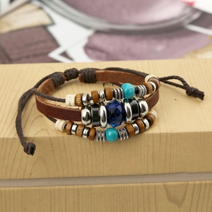 Handmade bohemian multilayer leather bracelet with wooden beads and turquoise accents