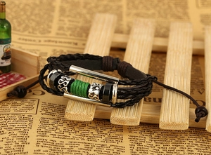 Detailed close-up of multilayer braided leather bracelet with vintage beads and adjustable cord
