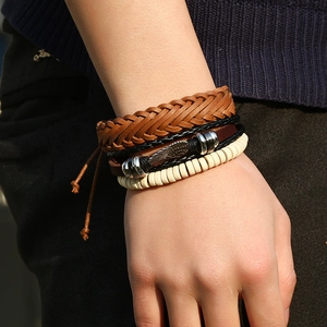 Vintage multilayer woven leather bracelet for men featuring a metal wing charm and beads