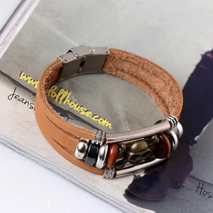 Retro multi-layer brown leather bracelet featuring a bronze skull charm and metal buckle