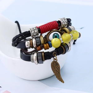 Bracelet multicouche en cuir avec perle mauvais œil et breloque aile en bronze de style punk