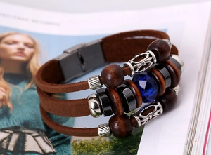 Macro shot of multilayer leather bracelet with blue crystal and wood beads
