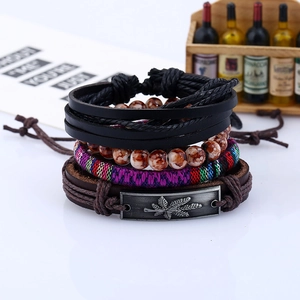 Retro multi-layer woven leather bracelet set featuring a metallic maple leaf charm