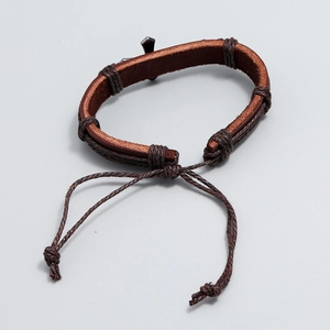 Handmade retro brown braided leather bracelet with adjustable cord and metal cross charm