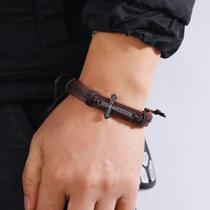 Men's vintage brown leather bracelet with adjustable cord and engraved metal cross