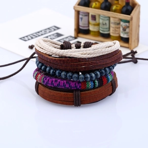 Set of 4 handmade woven leather bracelets with boho ethnic beads and geometric patterns