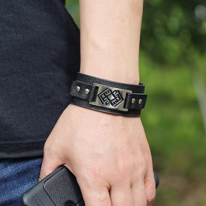 Minimalist black PU leather wristband featuring a silver metal plate with totem pattern