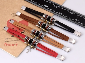 Detail of multi-layer leather punk bracelets with alloy cross charms and metal beads